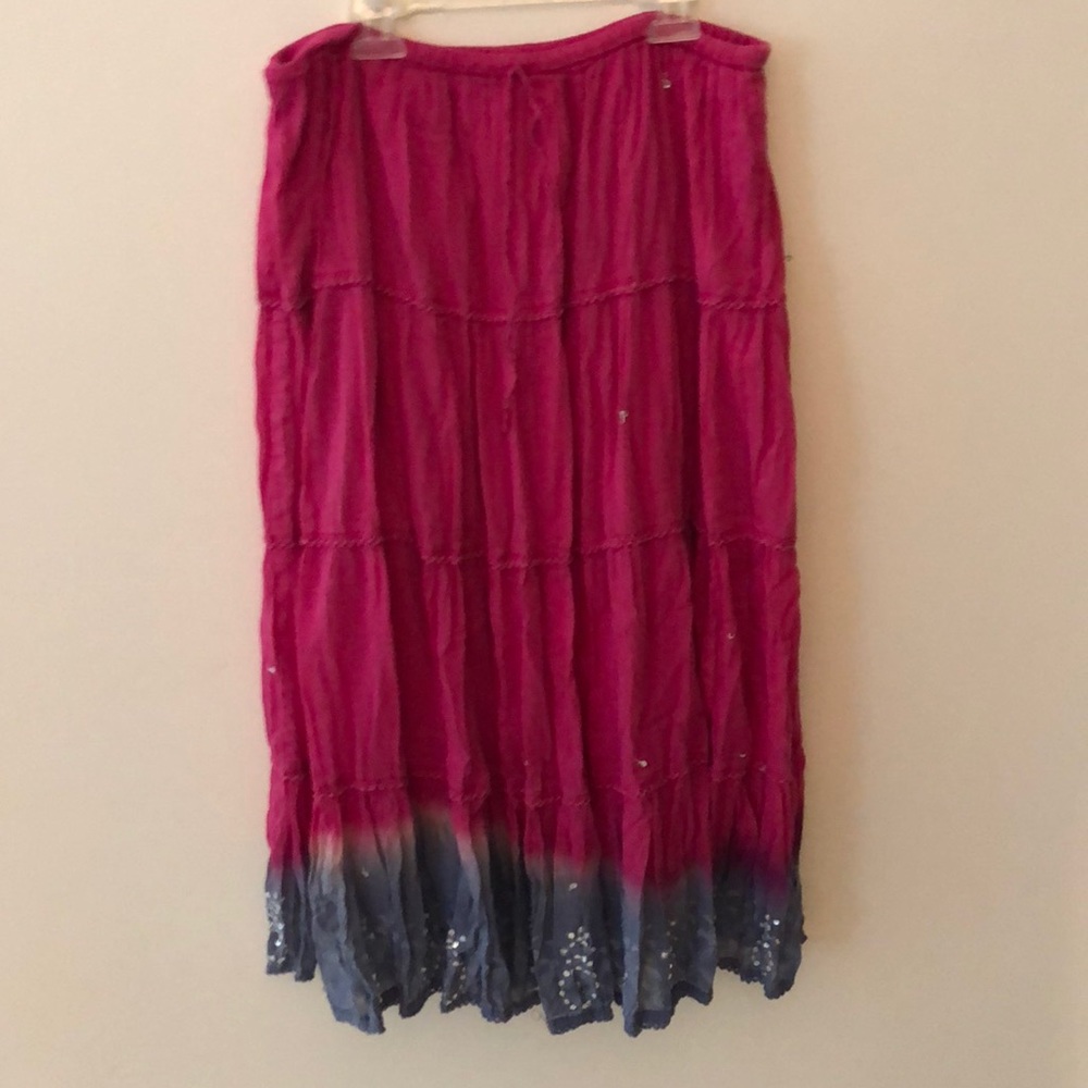 Fuschia tie dye skirt embellished with sequins.